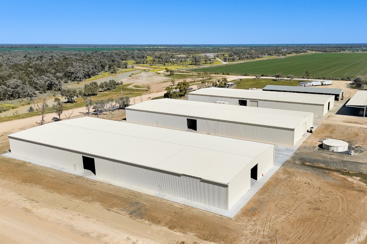 Aerial view of three clear span cotton bale storage sheds at P&J Harris & Sons Collymongle Gin, Collarenebri NSW, holding lint through to export
